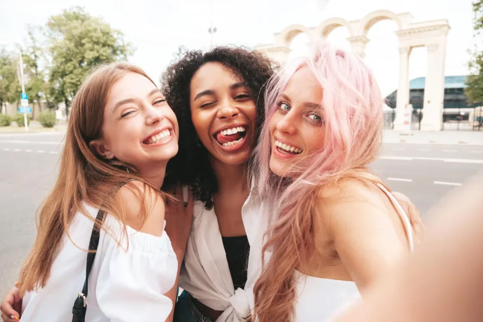 three-young-beautiful-smiling-female-trendy-summer-clothessexy-carefree-multiracial-women-posing-street-backgroundpositive-models-having-fun-sunglasses-cheerful-happy_158538-23041